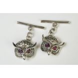 Pair of silver owl cufflinks with ruby eyes