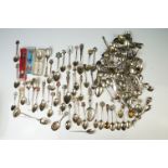 A large collection of crested souvenir teaspoons to include silver and silver plated examples.