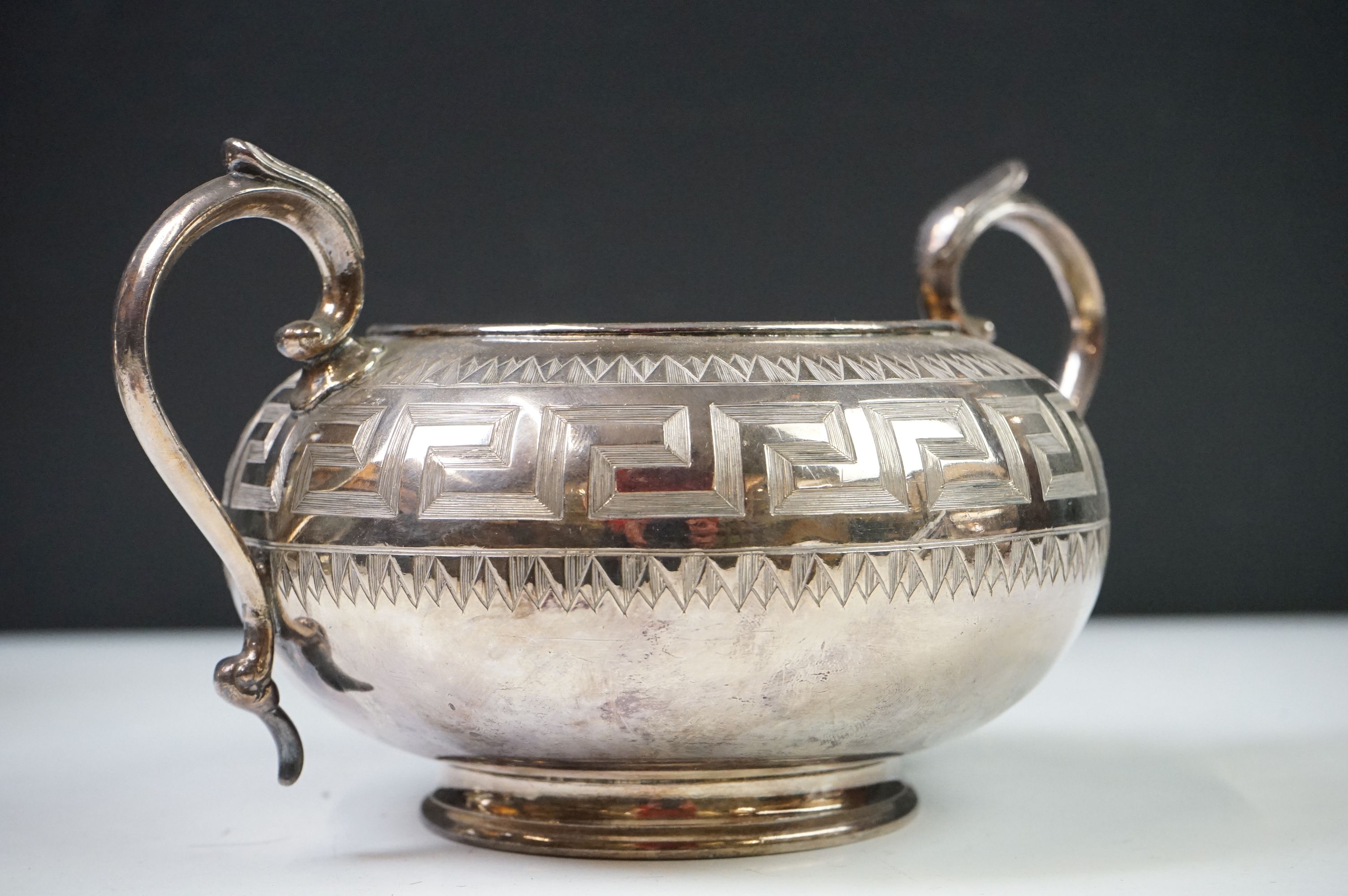 An antique silver plated tea set to include teapot, cream jug, sugar bowl and water jug decorated - Image 4 of 22