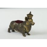 Brass cased pincushion in the form of a Royal Corgi wearing a crown