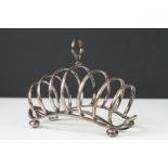 A large six slice fully hallmarked sterling silver toast rack, maker marked for Searle & Co Ltd with