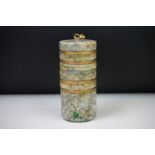 Cylindrical marble storage tower, each section lifting off to reveal five storage compartments, gilt