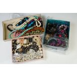 A collection of mainly contemporary costume jewellery contained within three trays.