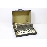 A vintage Hohner Verdi III accordion within original storage case.