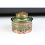 Art Nouveau German iridescent glass inkwell with hinged brass lid, housed within a pierced copper