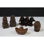 A collection of five Chinese ornaments to include foo dogs, happy buddha head and three wise