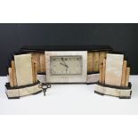 Art Deco marble & black slate clock garniture of geometric architectural form, the clock with