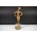 Art Deco gilt spelter figure, depicting a female dancer with feathered headdress, raised on a
