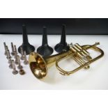 A Weltklang brass trumpet together with a selection of mouthpieces and accessories.