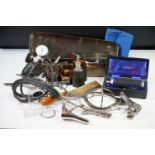A collection of vintage medical equipment to include a selection tools and medicine bottles.