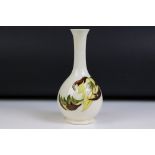 Moorcroft Pottery Bottle Neck Vase decorated in the ' Leaves in the Wind ' pattern, impressed