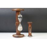 Early 20th century wooden sand timer (23.5cm high), together with a further 20th century sand