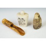 A group of three Chinese carved bone collectables to include a snuff bottle.