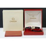 A ladies 9ct gold cased Omega wristwatch complete with original box.