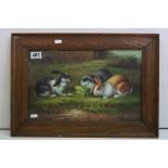 Oil Painting of Three Rabbits eating salad leaves in a garden, 26cm x 41cm, framed and glazed