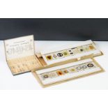 A collection of early 20th century glass microscope slides.