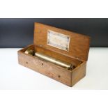 19th century Swiss cylinder rosewood music box, the marquetry inlaid lid opening to a 26cm long