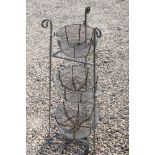 Galvanised steel three tier planter with graduated wire bowls, stands approx 86cm in height.