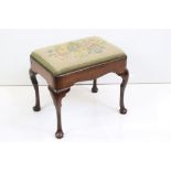 Queen Anne style Walnut Dressing Stool with tapestry upholstered drop-in seat and raised on cabriole