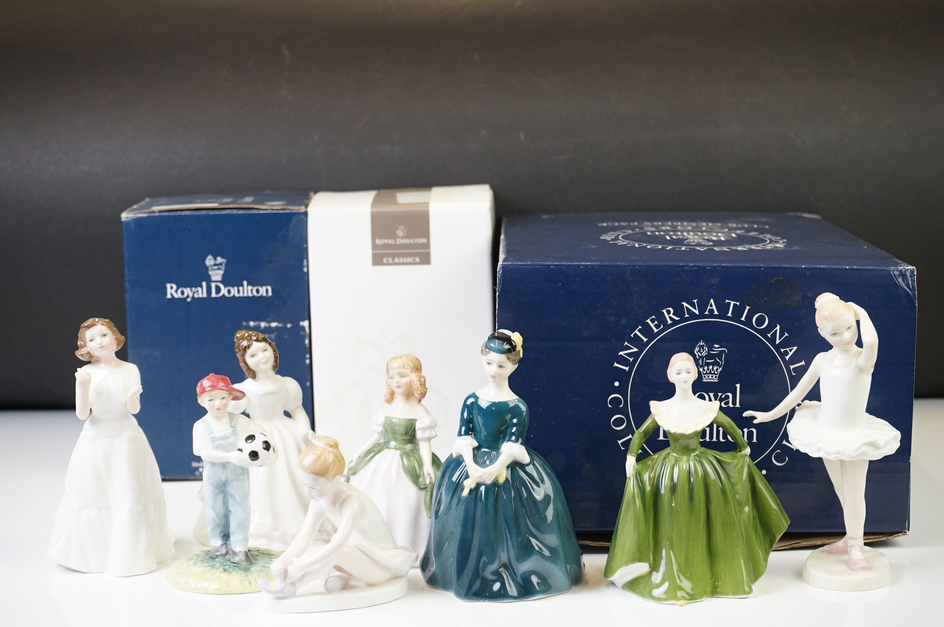 Seven Royal Doulton figures to include: 'Little Ballerina', HN 3395 'Welcome', HN 3764, 'Cherie', HN
