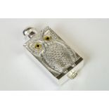 An unusual perfume bottle with embossed owl decoration stamped 800