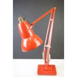 A mid twentieth century Herbert Terry Red Angle poise lamp with stepped base.