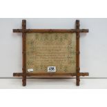 19th century sampler stitched with verses from the bible within a floral border, named & dated