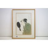 Kitagawa Utamaro 1753-1806. A signed Japanese woodblock portrait of a lady holding a looking
