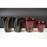 Four art glasses vases, a pair of green vases of loose, twisted form, 20cm high, a red vase of