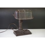 Art Deco Brown Bakelite desk lamp with metal column support. Measures approx 26.5cm high