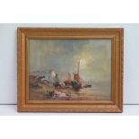 A gilt framed oil painting of coastal scene with fishing boats, horse & cart, figures and cliffs