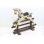 Late 19th / Early 20th century Piebald Painted Wooden Rocking Horse held on a pine trestle base,