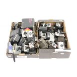 A large collection of Polaroid instant cameras to include a Polaroid 600 and SX-70 models.