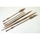 Two tribal souvenir three-section spears, with metal ends and wooden centre sections, strung