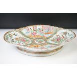 Chinese famille rose lozenge shaped dish of footed form, 37cm wide