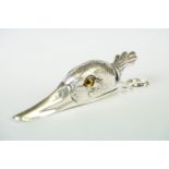 A large silver plated duck shaped document clip