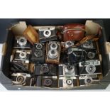 A collection of vintage cameras including an Olympus Trip 35 and a Lubitel TLR.