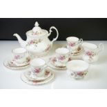 Royal Albert 'Moss Rose' part tea service, comprising: teapot and cover, milk jug, sugar bowl and