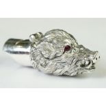 A silver plated whistle and vesta case in the form of a boars head with ruby eyes