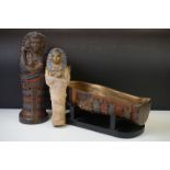 Statue of Tutankhamun in his sarcophagus, mounted on a wooden base (sarcophagus measures approx 32cm
