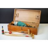 Vintage wooden toys in a croquet box