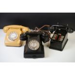 Three vintage telephones to include an early-to-mid 20th C black Bakelite example, a mid 20th C