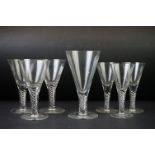 Seven clear wine glasses with air twist stems, the tallest 18cm high