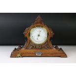 Victorian Baroque Revival carved oak mantle barometer, with scrolling decoration, raised on a