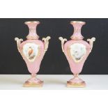 Pair of 19th century Porcelain Urns, hand painted with panels of birds against a pink ground with