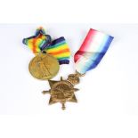 A pair of British full size World War One medals to include the victory medal and the 1914-15 star