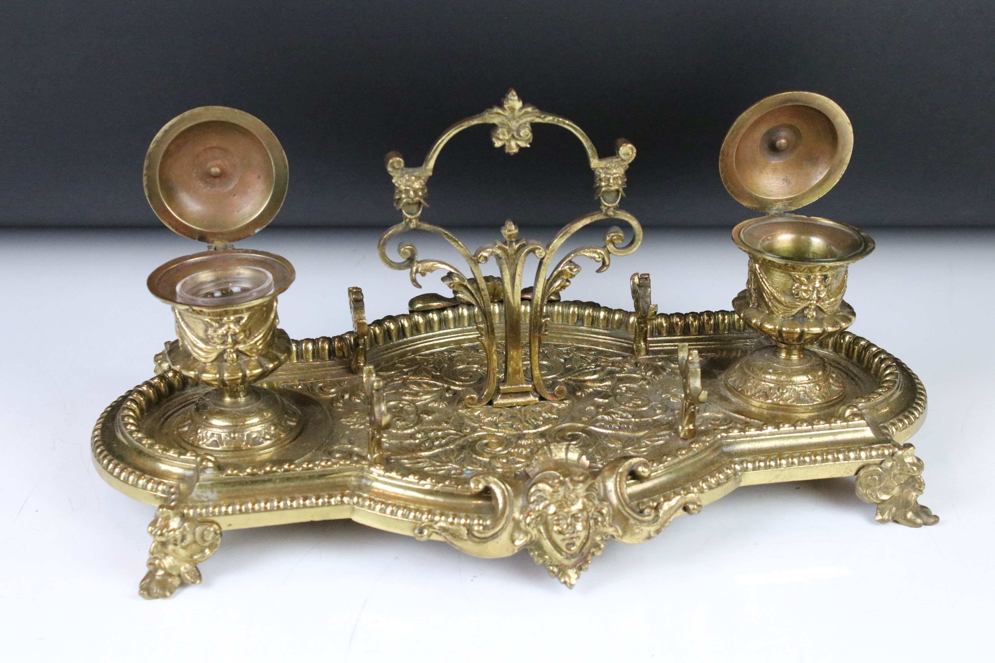 Brass standish with cast Gothic decoration, twin inkwells with glass liners (one matched), pen rests - Image 2 of 5
