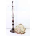 Early 20th century Oak Standard Lamp with a Pig Skin Shade decorated with figures and with a frilled