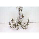 An early 20th century brass six branch chandelier with glass droplet decoration.