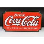 A Coca Cola branded enamel sign, measures approx 58cm x 31cm.